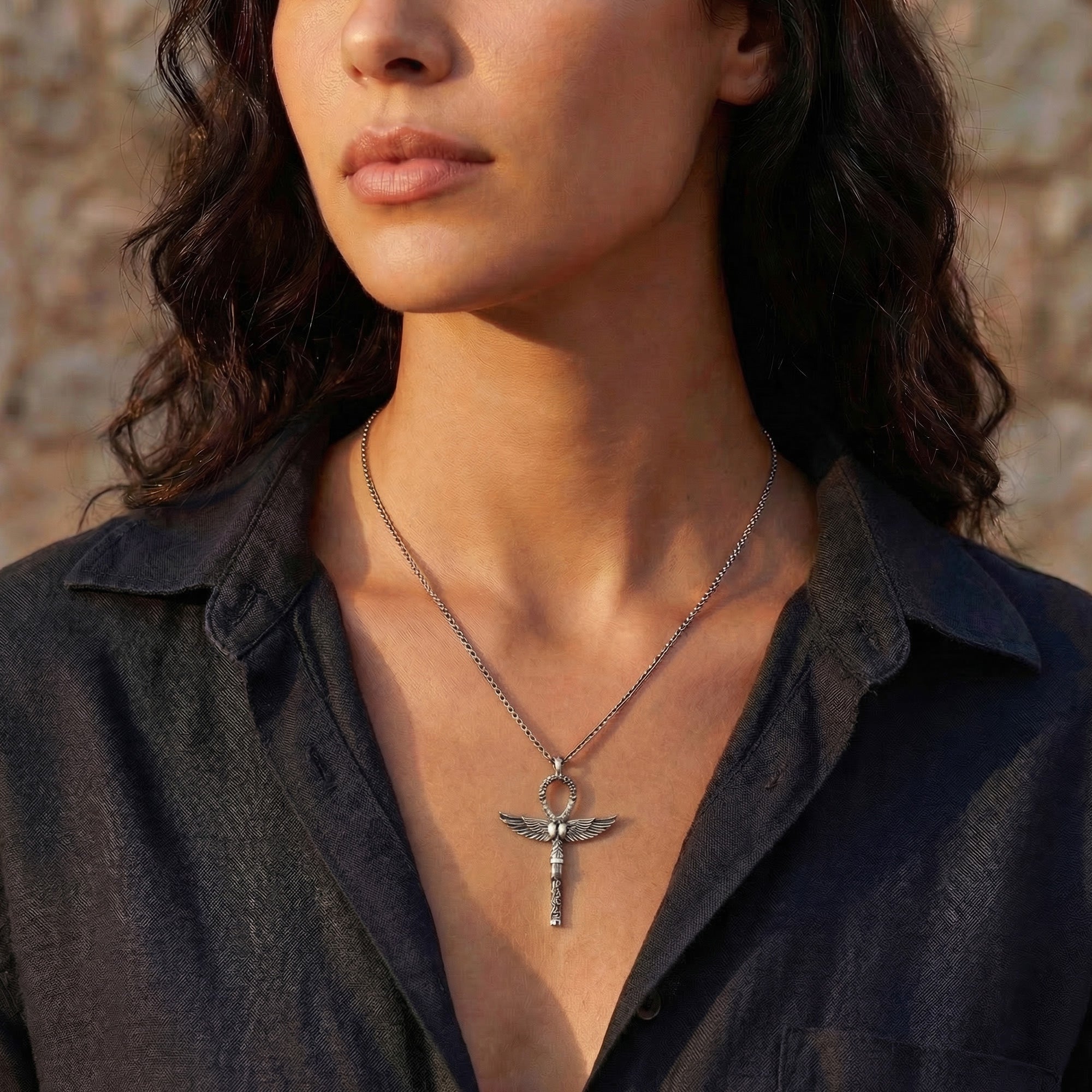 Woman wearing Thomas Sabo cross of life ankh scarab pendant.