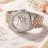 Thomas Sabo Ladies Flowers gemstone dial silver watch on a white marble table with a pink rose.