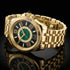 Thomas Sabo Mystic Island gold malachite watch sitting on a black mirror surface.