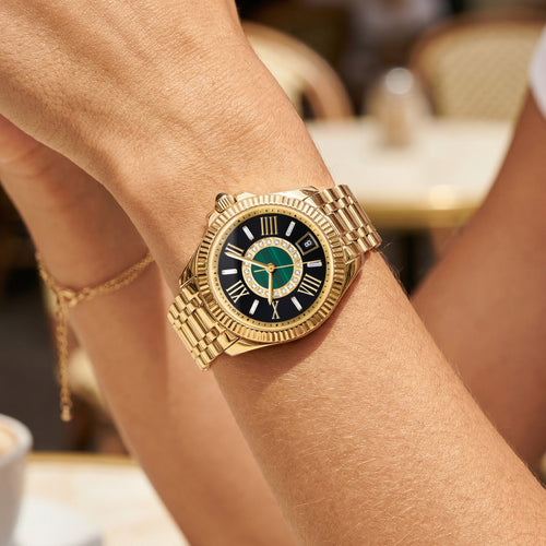 Woman wearing a Thomas Sabo Mystic Island gold malachite watch.