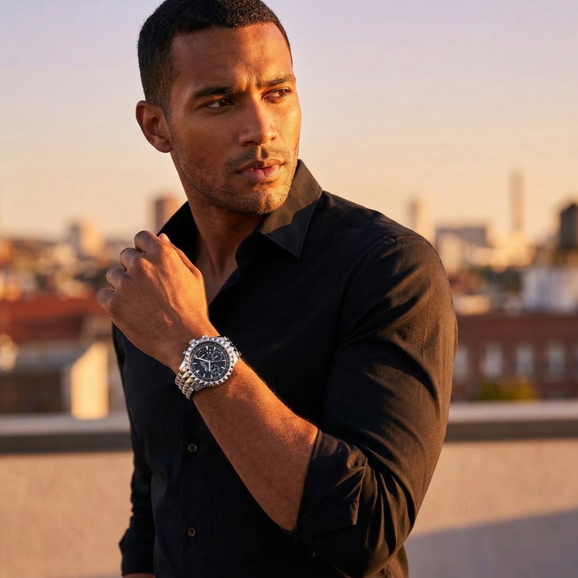 Man standing on a rooftop wearing Thomas Sabo Rebel At Heart silver pyramid men's watch.