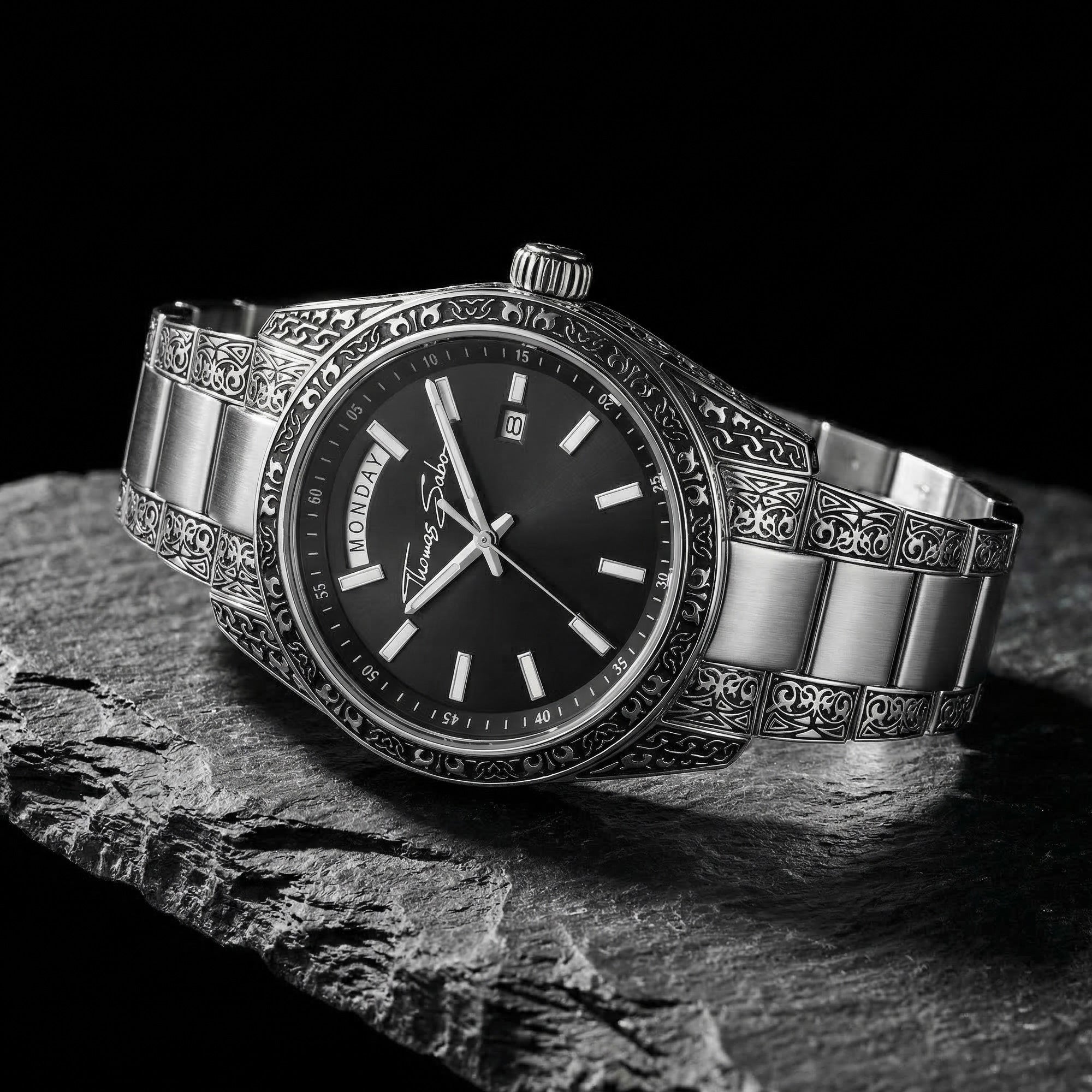 Thomas Sabo Rebel At Heart Revive 40mm black dial watch laying on a piece of black slate.