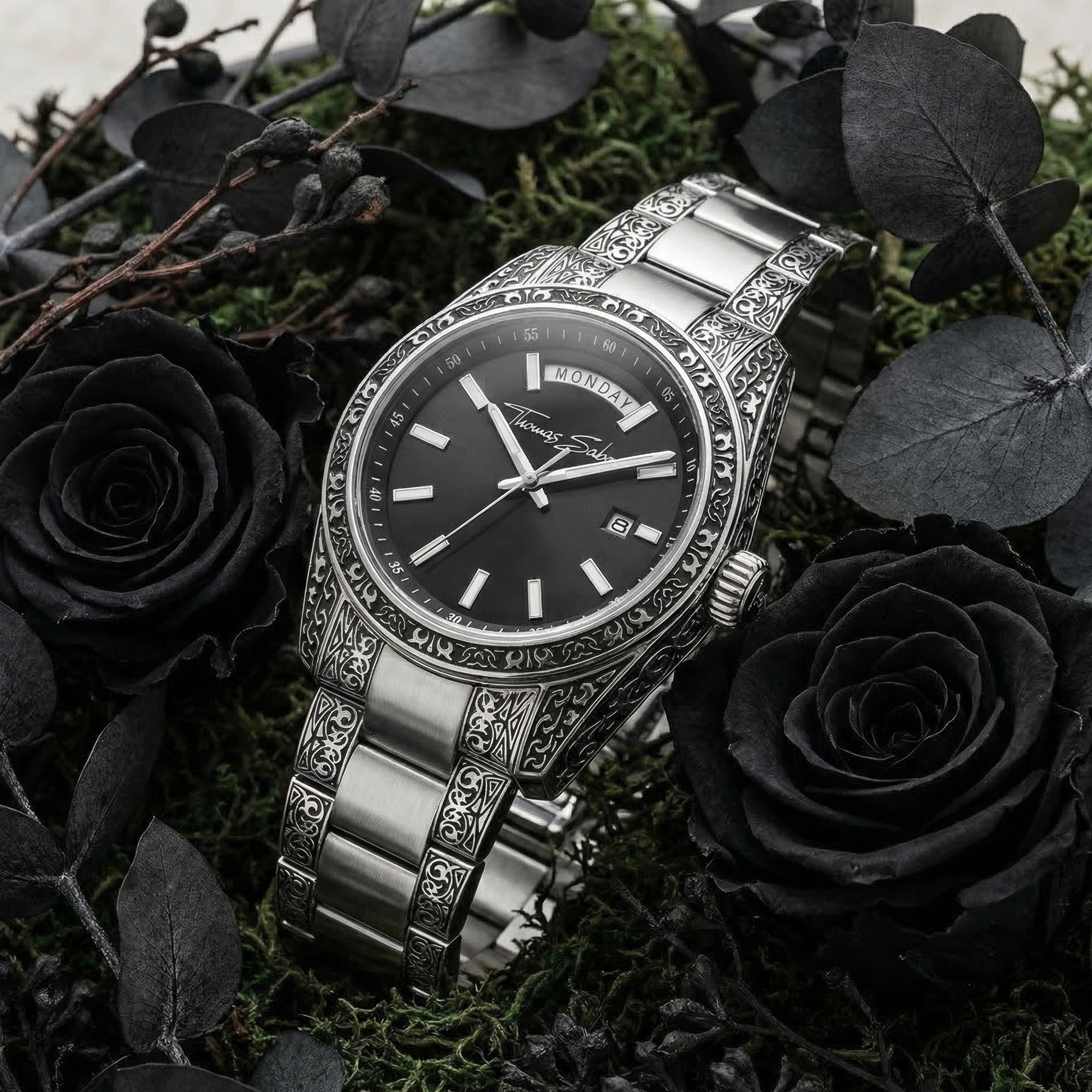 Thomas Sabo Rebel At Heart Revive 40mm black dial watch laying on a heath surrounded by black roses.