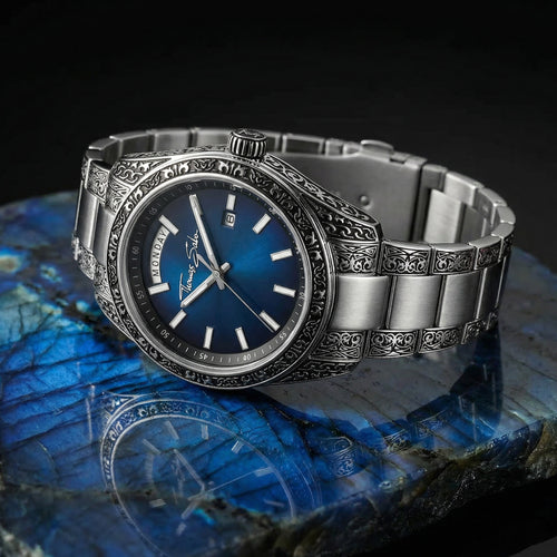 Thomas Sabo Rebel At Heart Revive 40mm blue dial watch laying on a polished slab of deep blue marbled labradorite stone.