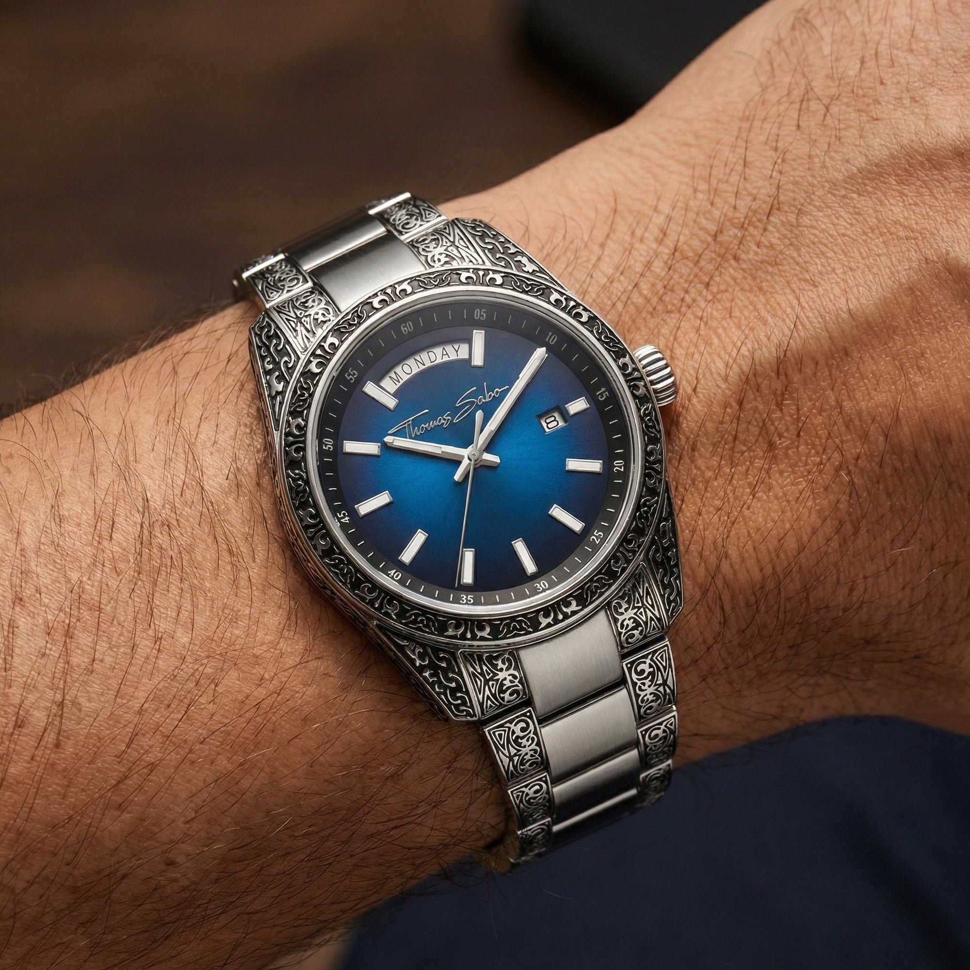 Man wearing a Thomas Sabo Rebel At Heart Revive 40mm blue dial watch on his wrist.