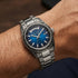 Man wearing a Thomas Sabo Rebel At Heart Revive 40mm blue dial watch on his wrist.