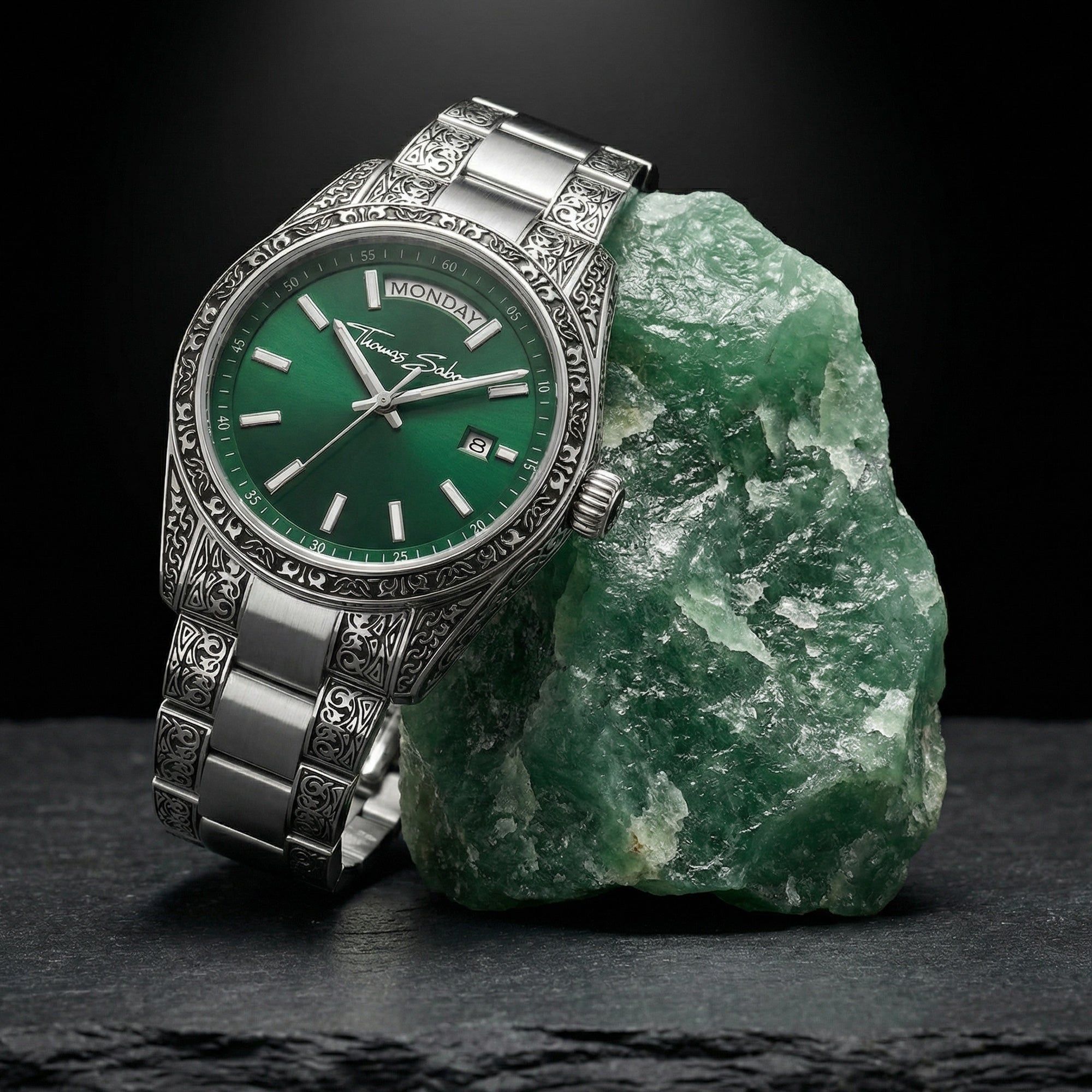 Thomas Sabo Rebel At Heart Revive 36mm green dial watch laying against a raw piece of jade.