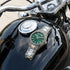 Thomas Sabo Rebel At Heart Revive 36mm green dial watch resting on the black fuel tank of a motorcycle.
