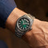 Close-up of man's wrist wearing a Thomas Sabo Rebel At Heart Revive 40mm green dial watch.