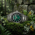 Thomas Sabo Rebel At Heart Revive 40mm green dial watch laying on a bed of moss and lichen at the base of an ancient stone wall.