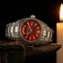Thomas Sabo Rebel At Heart Revive 36mm red dial watch on an iron anvil by candlelight.