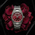 Thomas Sabo Rebel At Heart Revive 36mm red dial watch laying on a bed of red rose petals on black velvet.