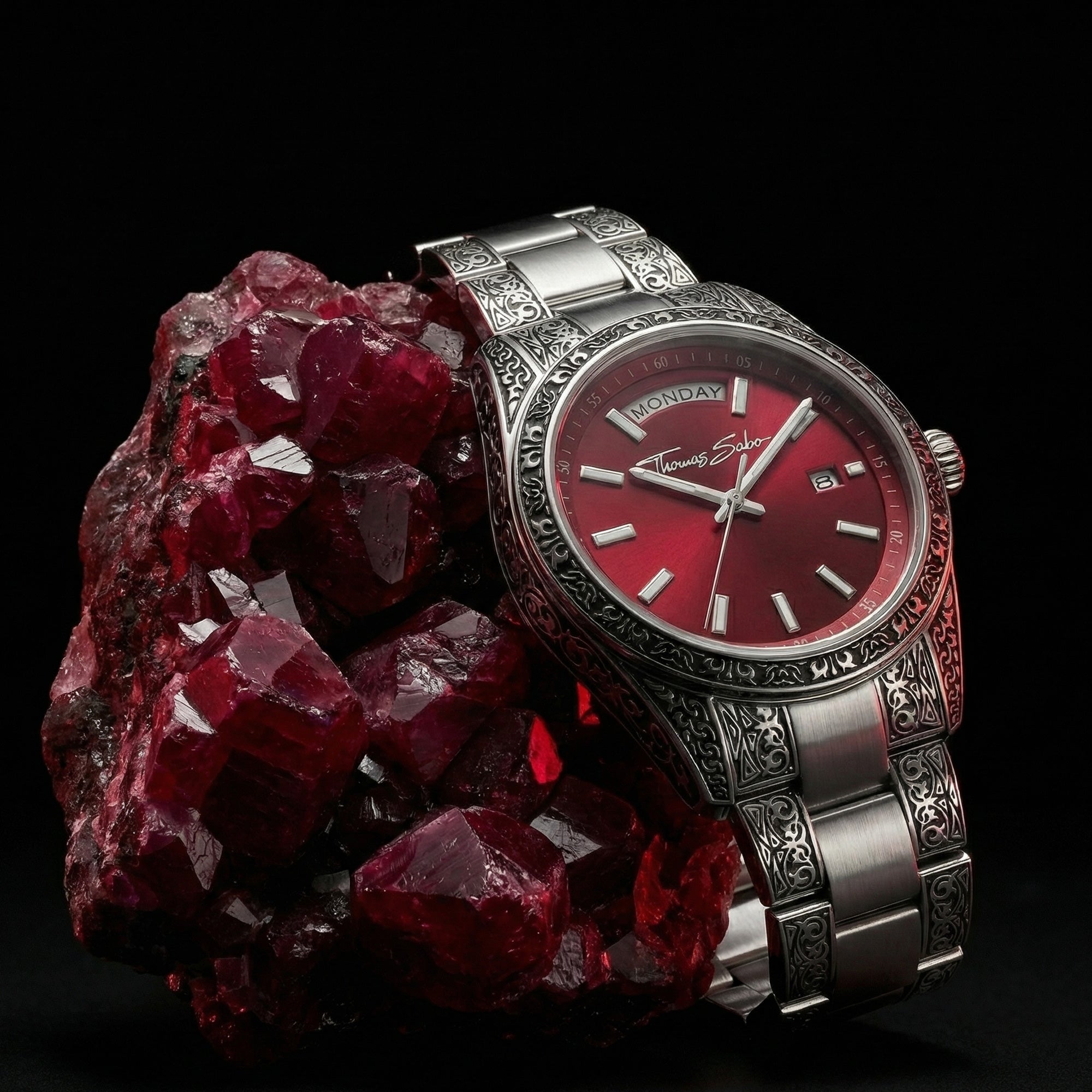 Thomas Sabo Rebel At Heart Revive 36mm red dial watch laying against a raw red ruby cluster.