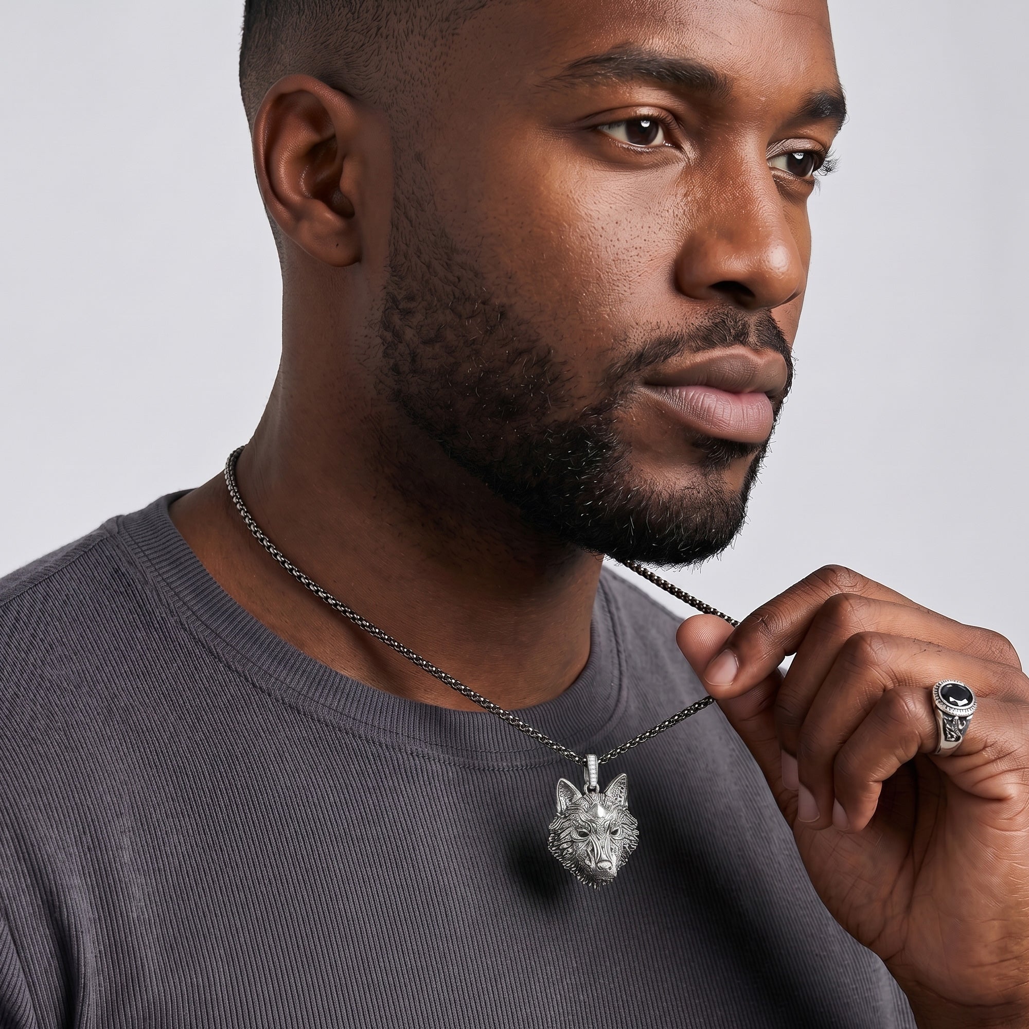 Man wearing Thomas Sabo Rebel Wolf Head sterling silver pendant on a silver chain.