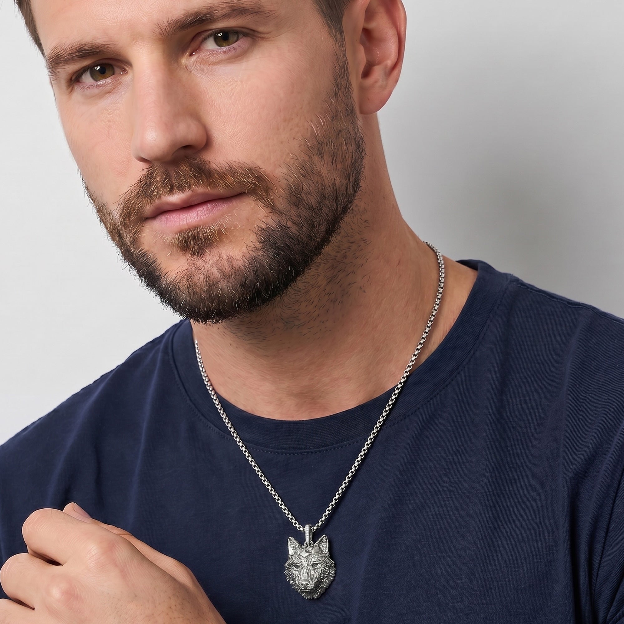 Man wearing Thomas Sabo Rebel Wolf Head sterling silver pendant.