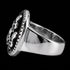 A three skulls stainless steel men's signet ring tilted to the left.