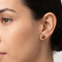 Woman wearing Engelsrufer tiger eye sterling silver circle earrings.