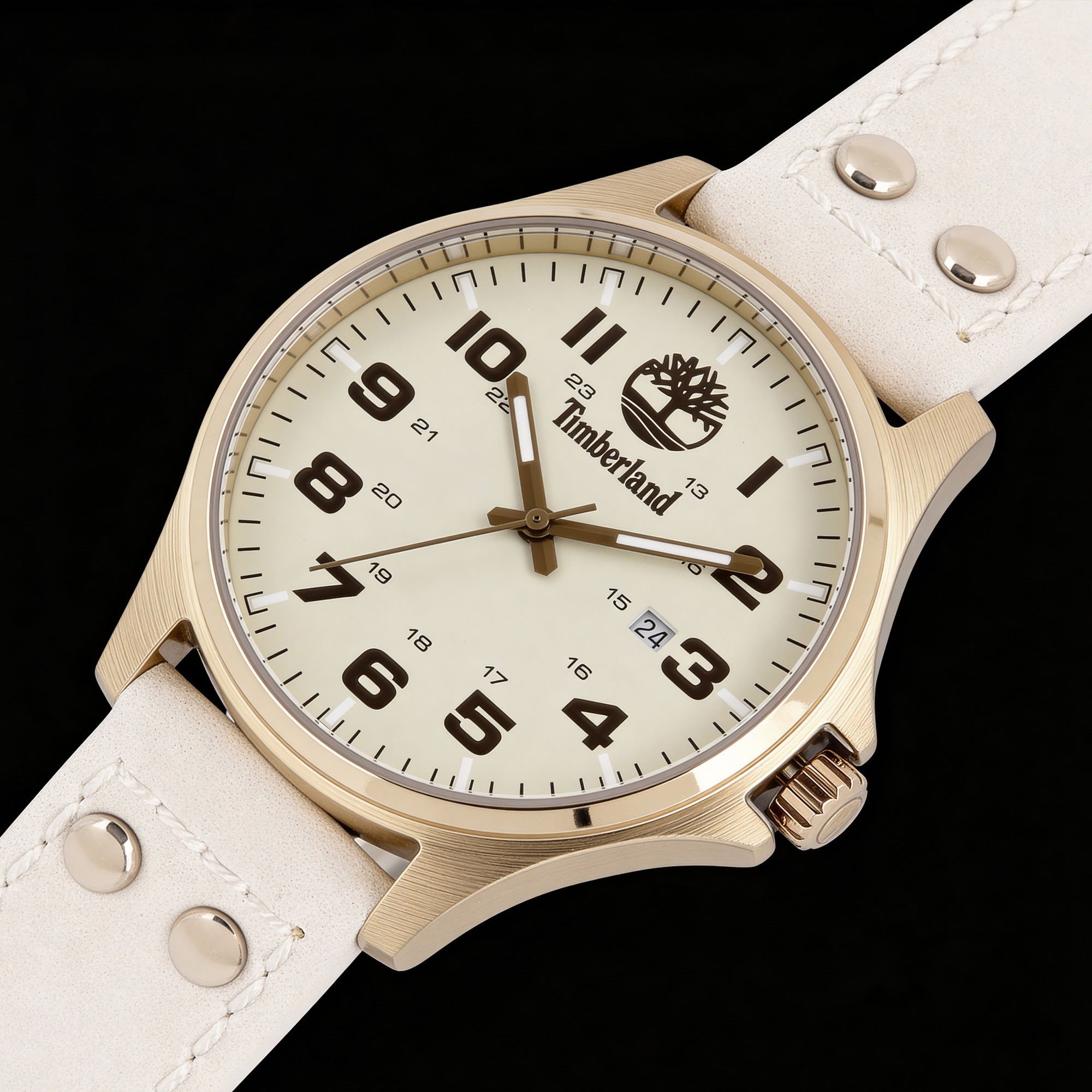 Timberland Alstead gold sand dial leather strap watch laying flat on black background.