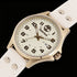 Timberland Alstead gold sand dial leather strap watch laying flat on black background.