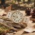 Timberland Alstead gold sand dial leather strap watch in an outdoor setting.