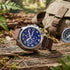 Timberland Brenton blue dial brown leather watch in a bush setting.
