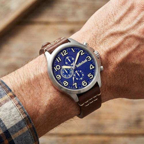 Man wearing Timberland Brenton blue dial brown leather watch.