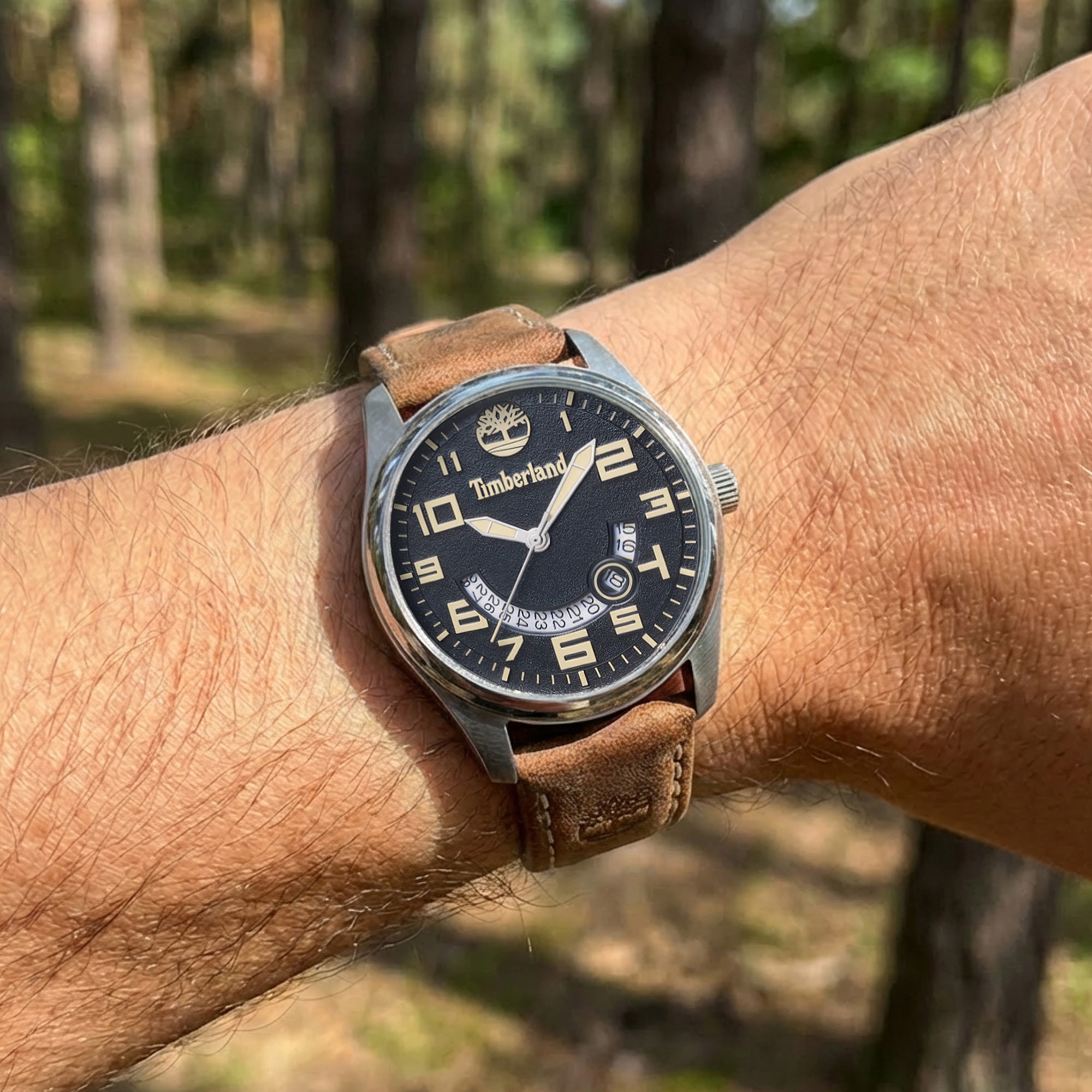 Man wearing Timberland Lemington silver black dial tan leather watch.