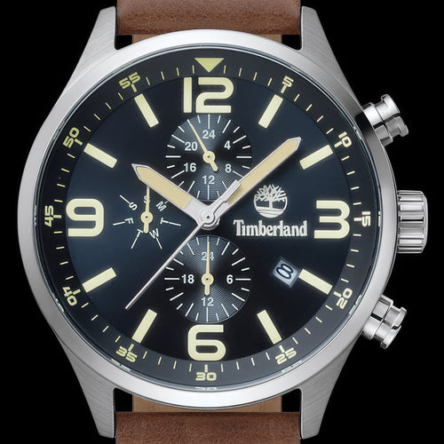 Dial close-up of Timberland Rutherford black dial brown leather watch.