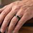Man wearing a titanium black mesh twin CZ men's ring on his hand,