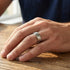 Man wearing titanium matte finish notched edge ring.
