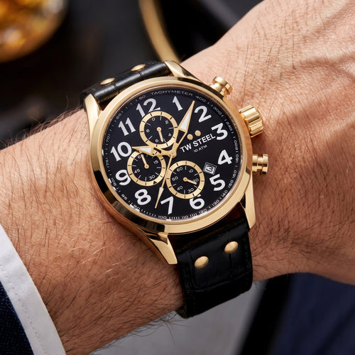 Man wearing a TW Steel VS88L Volante gold black dial numbers chronograph watch on his wrist.