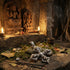 A vajra cross sterling silver pendant lying on a stone altar in a temple.