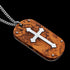 Tilt angled view of a cross wood inlay steel dog tag necklace.