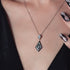 GEORGINI REFLECTION ART DECO SILVER & BLACK NECKLACE - CLOSE-UP