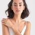 ANIA HAIE MINIMALISM GOLD MODERN SOLID BAR BRACELET - MODEL VIEW
