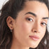 ANIA HAIE MINIMALISM SILVER MODERN HOOP EARRINGS - MODEL VIEW