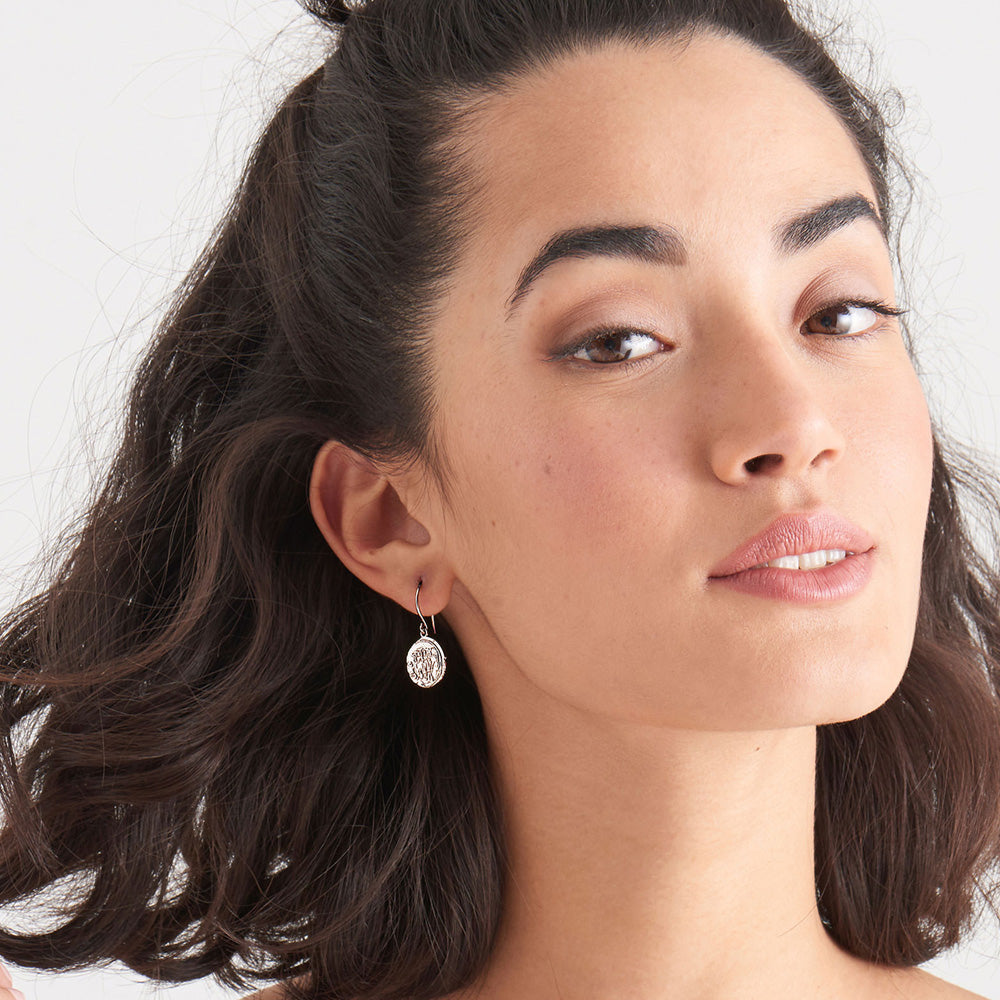 ANIA HAIE COINS SILVER EMBLEM HOOK EARRINGS - MODEL VIEW