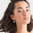 ANIA HAIE COINS SILVER EMBLEM HOOK EARRINGS - MODEL VIEW