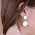 BRONZALLURE BEE YOU COIN DANGLING EARRINGS - MODEL VIEW