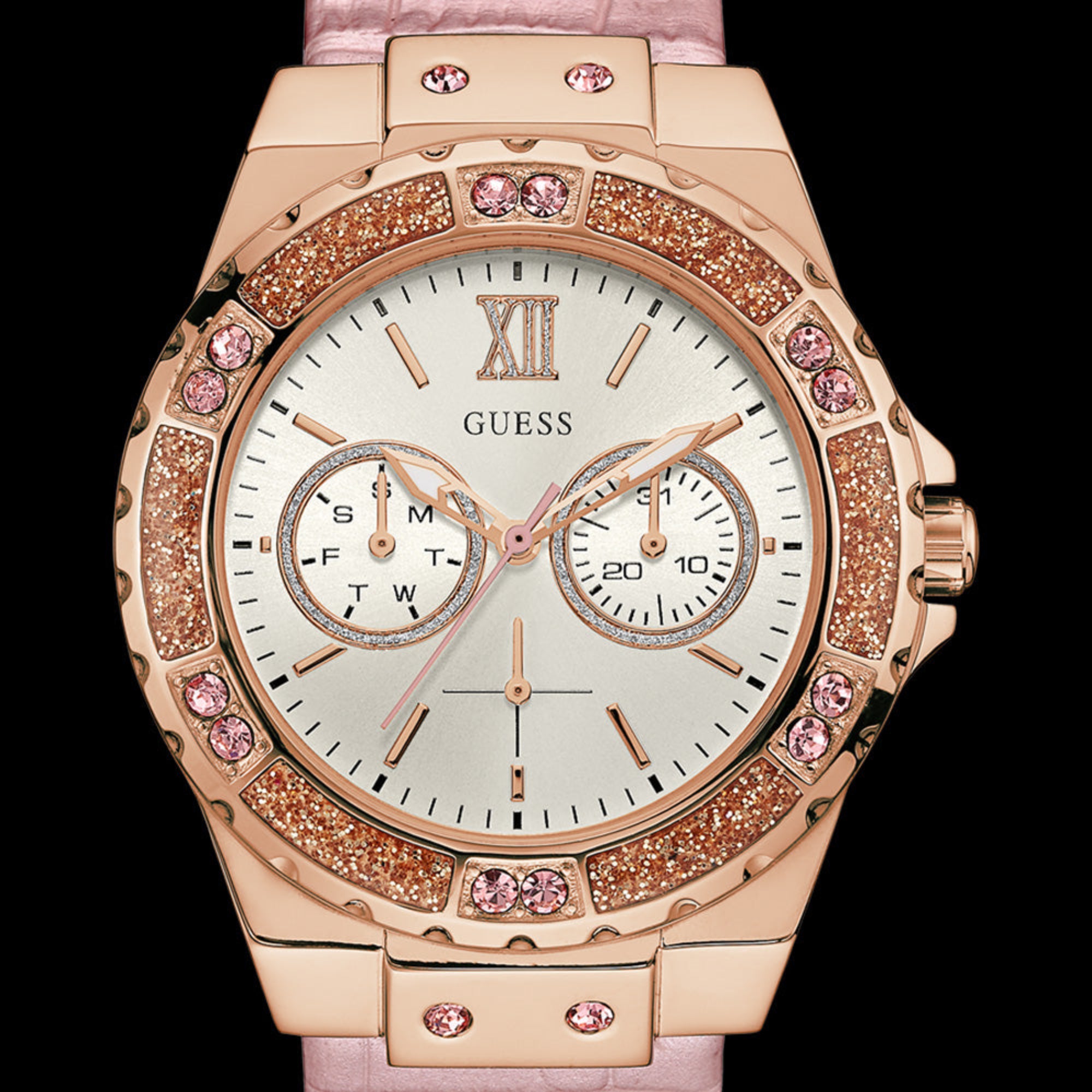 Close-up Guess Limelight rose gold ladies dress watch.