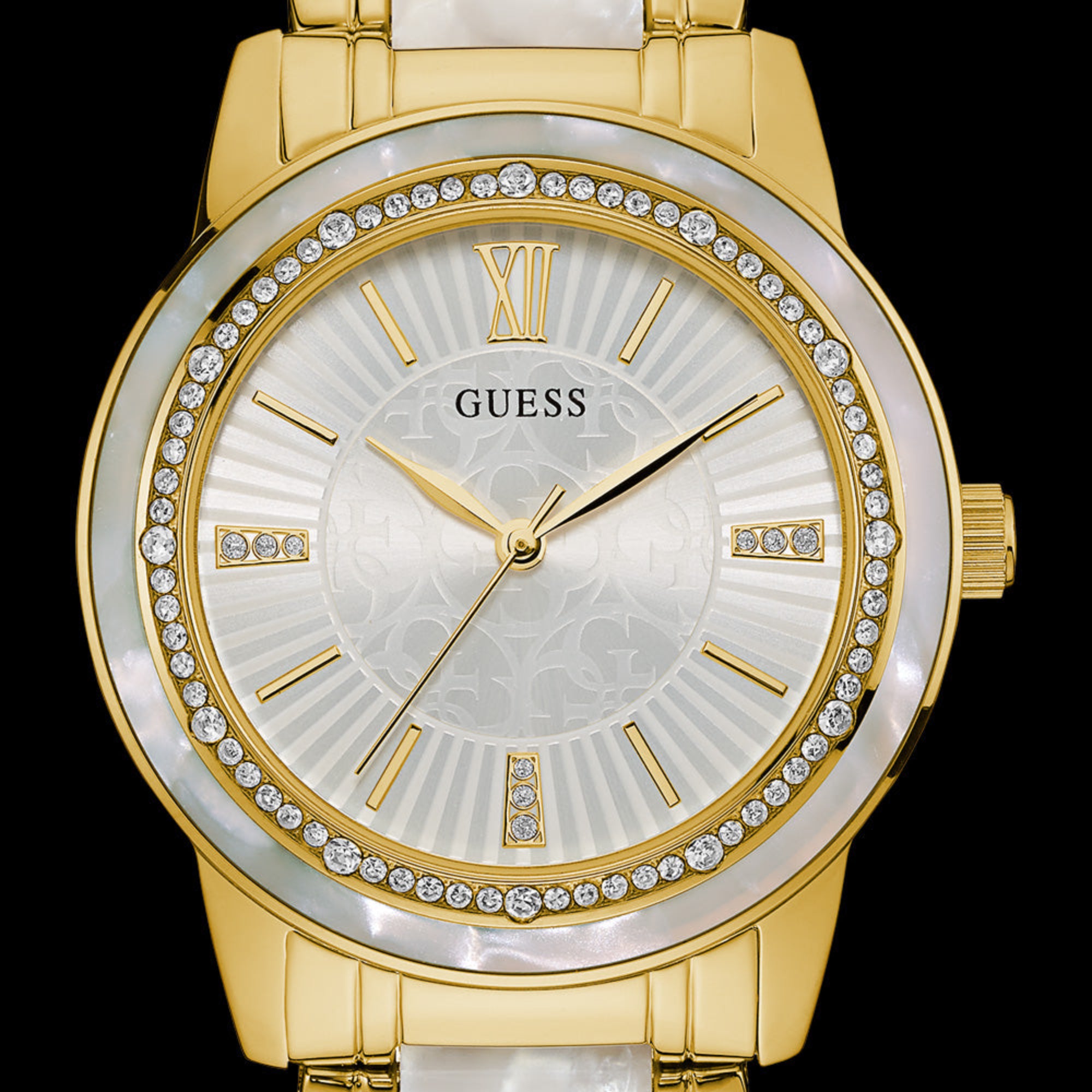 Close-up of Guess Trinity gold ladies watch.