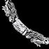 Twin dragon heads sterling silver bracelet clasp close-up.