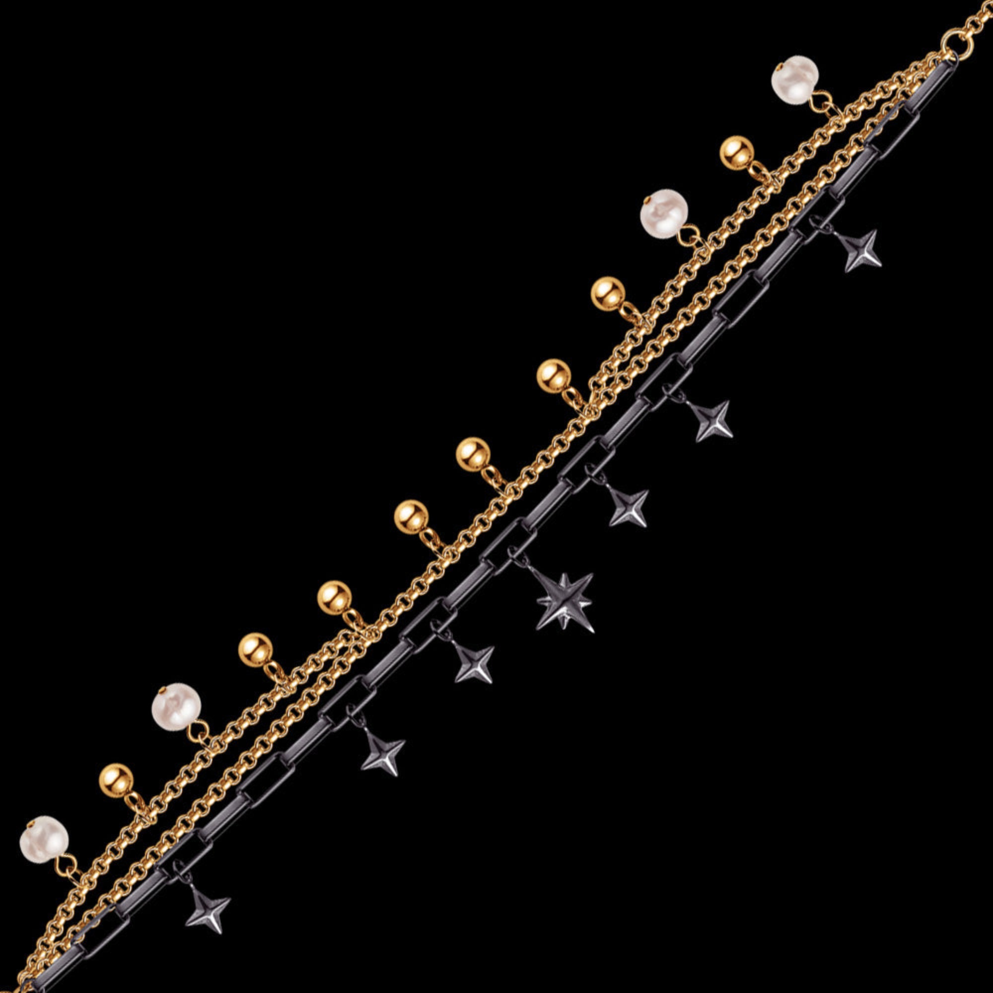 Full view of an Engelsrufer wind rose gold and black boho pearl bracelet laying flat.